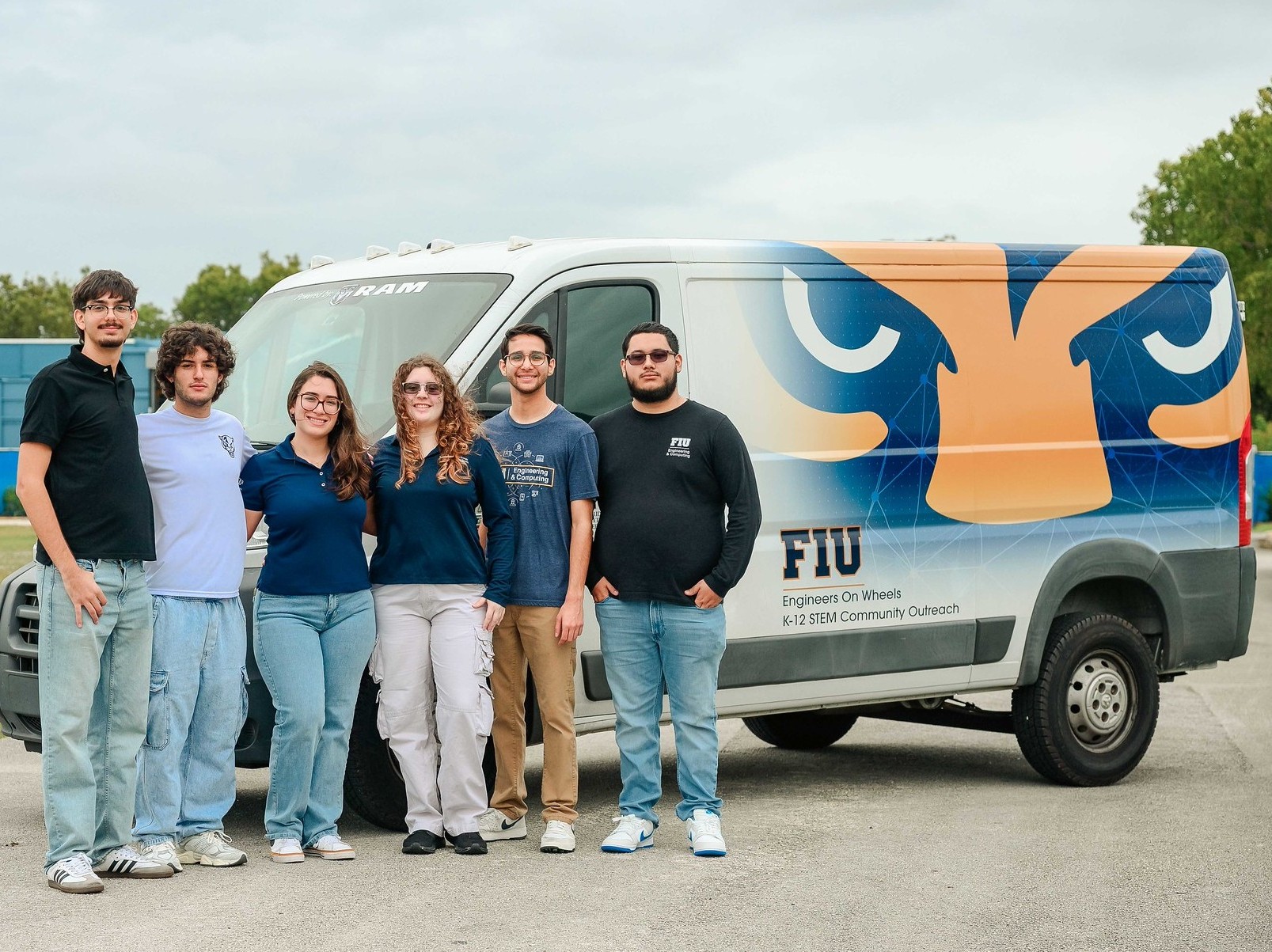 Students standing in front of Engineering on Wheels van