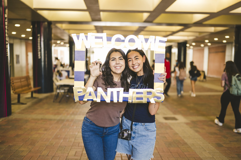 University Students with a Welcome Panther Frame
