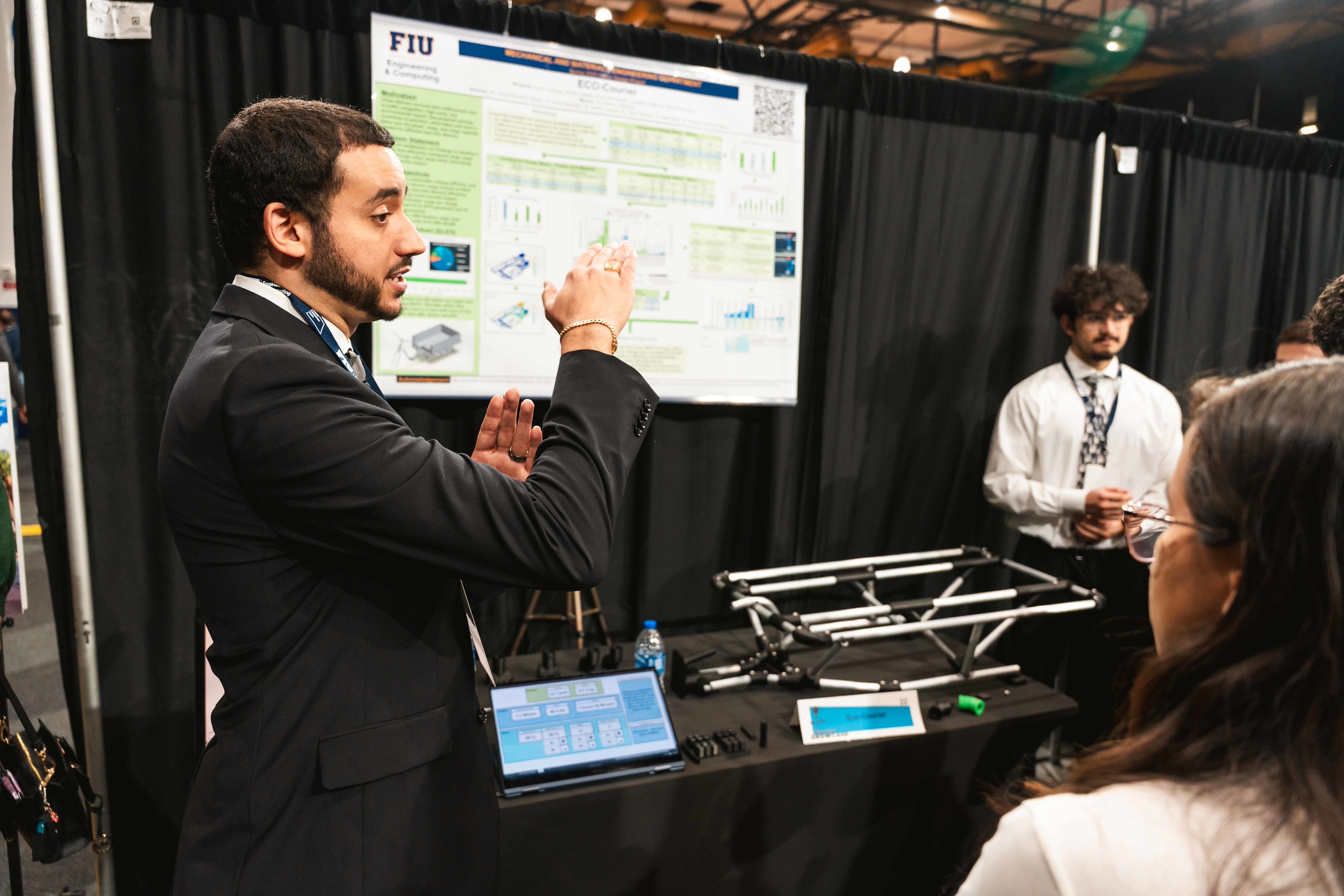 Student explaining research