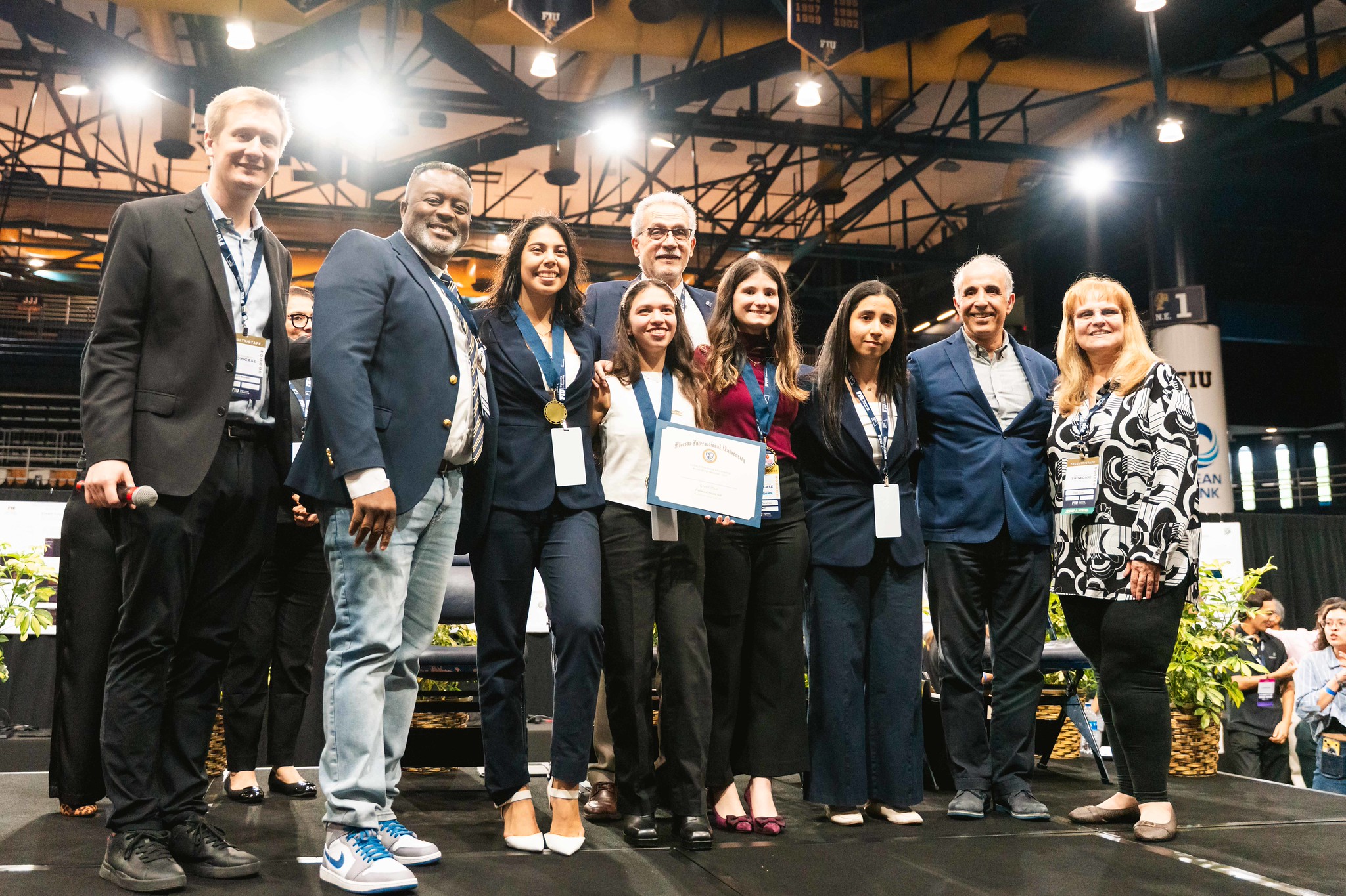 Awarded students standing alongside FIU Faculty